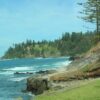 waves crashing against grass-covered island - Norfolk scenic beauty